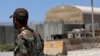 AFGHANISTAN -- An Afghan Army soldier stand guard at the gate of Bagram Airfield, June 25, 2021