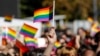 KOSOVO -- A participant vawe rainbow flags during Kosovo's first-ever LGBT pride parade held in Pristina, October 10, 2017