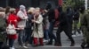 BELARUS -- Law enforcement officers walk to disperse opposition supporters, mostly pensioners, during a rally to reject the presidential election results in Minsk, Belarus October 12, 2020.